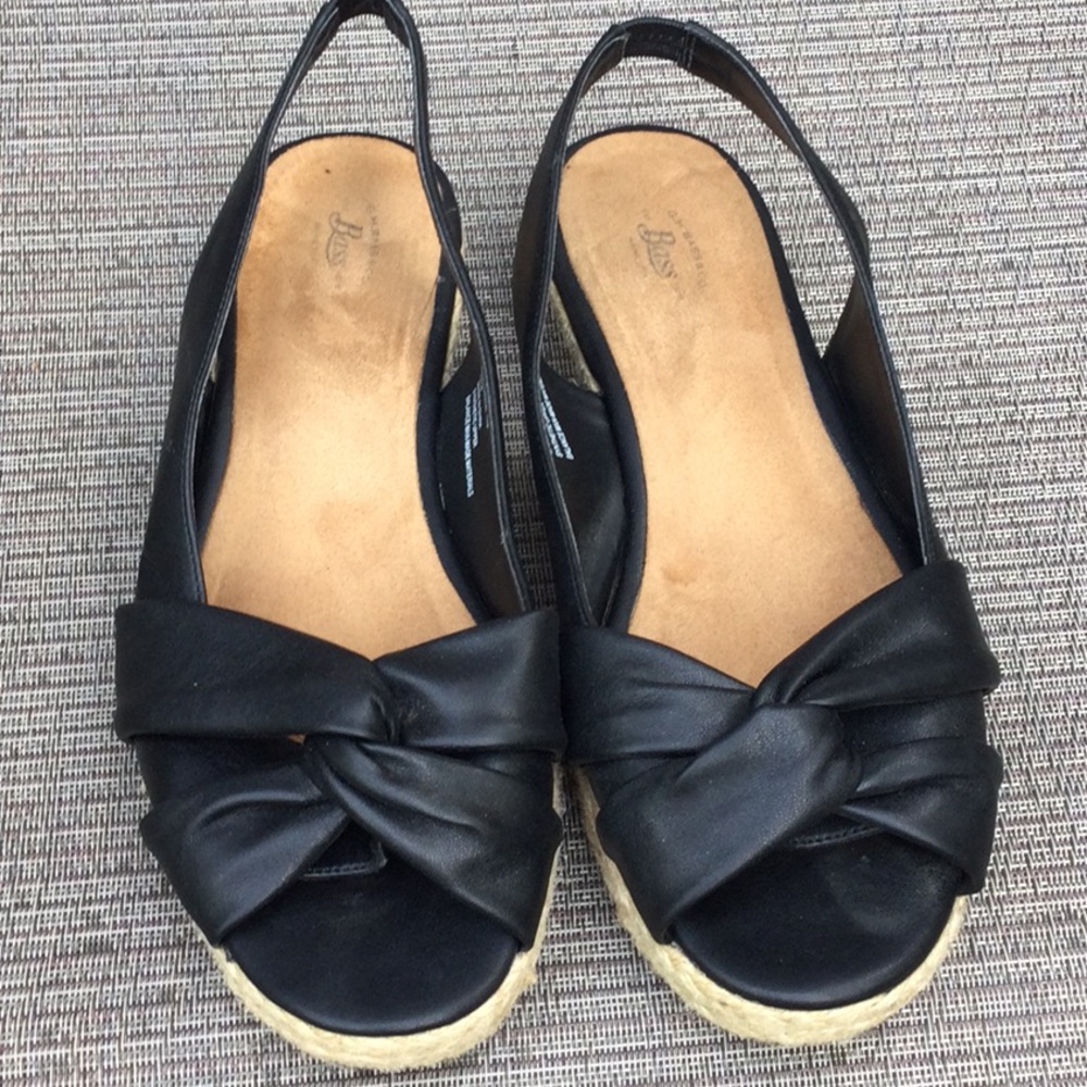 Soft black sandal with stretchy heel strap.  1 1/2 in heel
